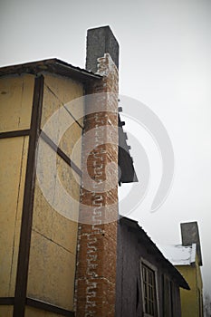 Old chimney. Old type building. Architectural details