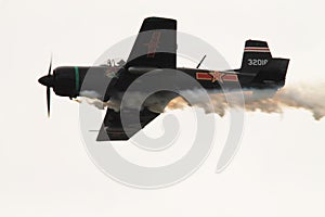 Old Chinese fighter plane flying and smoking