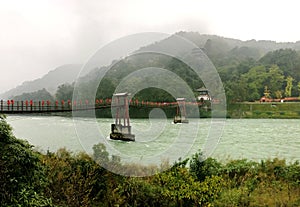 The old Chinese style bridge on the river of Dujiangyan, Sichuan, China