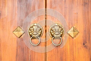 Old Chinese wooden door style with lion head knocker