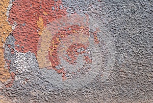 Old chipped plaster on the concrete wall texture background