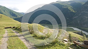 Old Chui tract. A lonely country road among the mountains. Bright rich greens