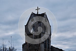 Old Church against a cloudy sky. Ruined temple tower in Halloween style