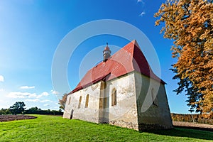 Old church in the autumn field. Dobronice u Bechyne, Czech republic