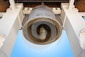 Old church bell with blue sky in the temple of lamphun