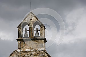 Old church bell tower with a grey sky