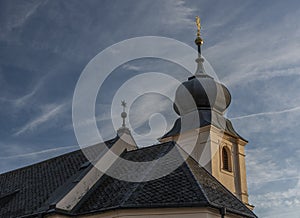 Old church with blue sky in Besiny village in autumn evening