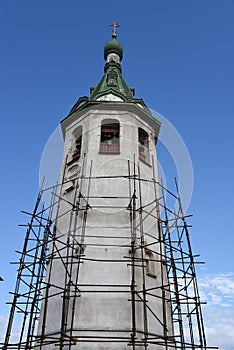 The old church building with a bell tower in Volkhov.