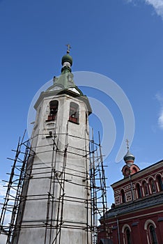 The old church building with a bell tower in Volkhov.