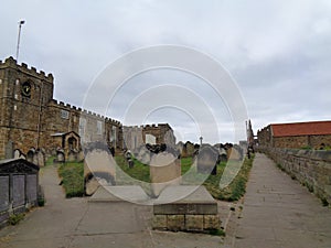 an old church with the graveyard in front