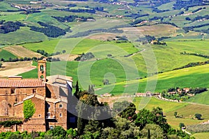 Old church and farm fields in Montalcino town, Val d`Orcia, Tusc