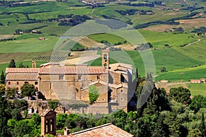 Old church and farm fields in Montalcino town, Val d `Orcia, Tusc