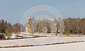 An old church and graveyard on the top of a small hill