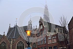 Old Church and historical houses in Amsterdam