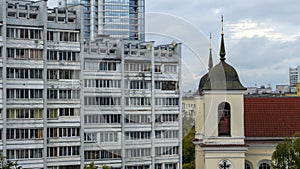 Old church and Modern resedential building. A combination of history and modernity