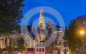 The old church Oude Kerk in Amsterdam city at night, Netherlands.