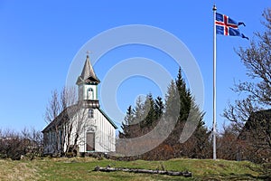 Old church Pingvallkirkja on sunny day in Thingvellir, Iceland