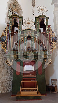 Old church pipe organ with colorful details