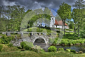 Old church and stone bridge in Sweden