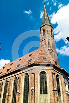 Old church with tall steeple or bell tower