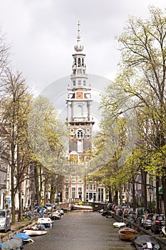 Old church tower and canal in Amsterdam