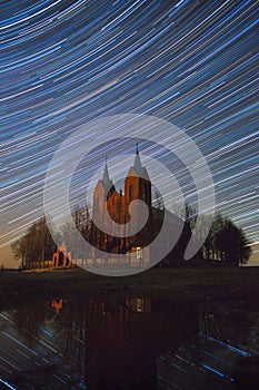 Old church under star trails