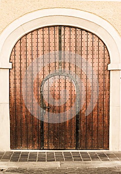 Old church wood textured door with stone arch