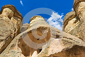 Caves in Fairy Chimneys rock formation Cappadocia Turkey