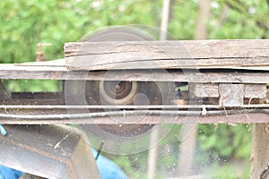 Old circular saw blade cutting wood