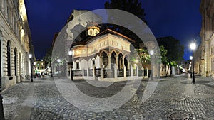 Old city center of Bucharest by night - Stavropoleos monastery photo