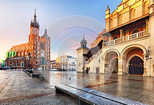 Old city center view with Adam Mickiewicz monument and St. Mary`s Basilica in Krakow on the morning