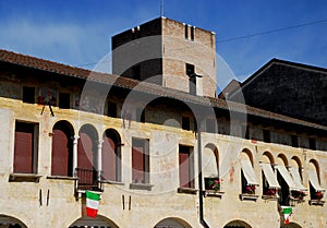 Old City Hall with flowers in Oderzo in the province of Treviso in the Veneto (Italy)