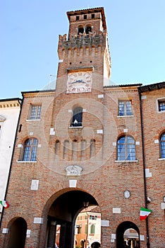 Old City Hall with flowers in Oderzo in the province of Treviso in the Veneto (Italy)