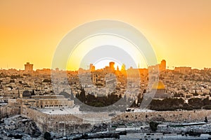 Old city of Jerusalem on the temple mount under golden sunset in the evening with golden dome of the rock, Al-aqsa mosque, sunset
