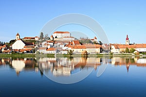 Old city Ptuj with castle and a reflection in river Drava.