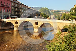 The old city of Sarajevo with bridge over the river Miljacka.