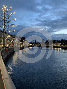 Old city of Zurich with Christmas decorations and illuminations on the left bank of Limmat River