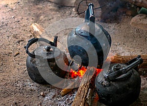 Old classic kettle cooked on firewood is an ancient cooking.
