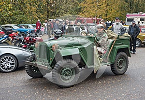 Old classic Soviet Army military car GAZ at a car show