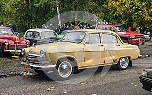 Old classic Soviet limo sedan car Volga GAZ-21 at a car show