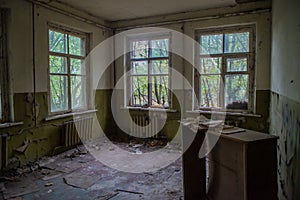 Old classroom with window in the kindergarten at the abandoned village Kopachi near Chernobyl