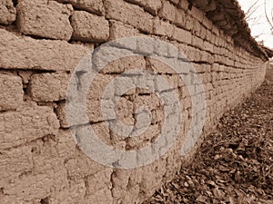 Old clay brickworks in Sepia colour. Wall clay bricks and cracks suitable for rustic retro style background.