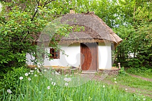 Old clay house with straw roof