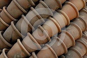 Old clay pots in layers. Traditional gardening tool