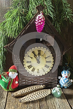 Old clock with Christmas toys under the Christmas tree