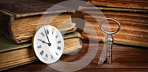 Old clock face and key, escape room game banner