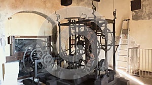 Old clock mechanism with gears and strings