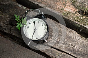 Old clock retro style show 7 o`clock on wood