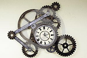 Old clock with sprockets photo