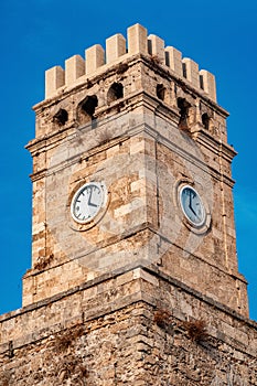 Old clock tower against the sky close-up